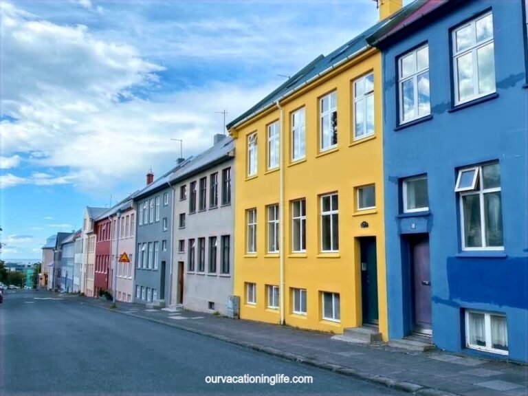 A street in Reykjavik Iceland, showing colorful buildings and blue skies.