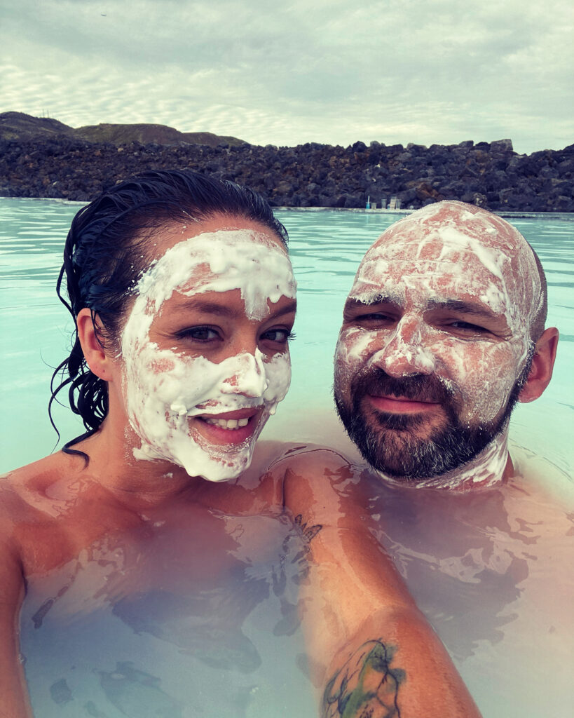 A couple bathing in the Blue Lagoon in Iceland.