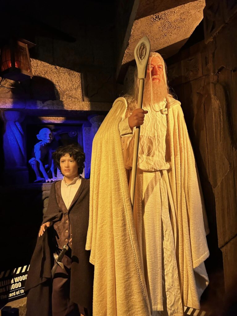 a hobbit and wizard wax sculpture