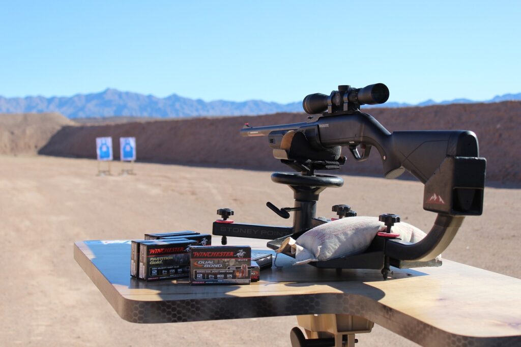 a black rifle on a stand in the desert