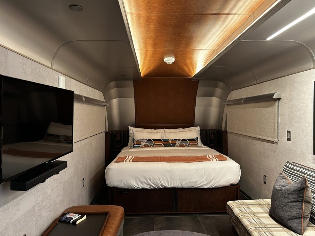 a bed inside a Backstage At The Verb trailer
