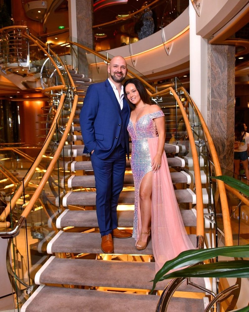 a couple on a winding staircase