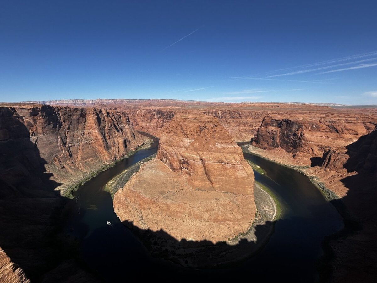 Horseshoe Bend in Arizona, with blue sky above.